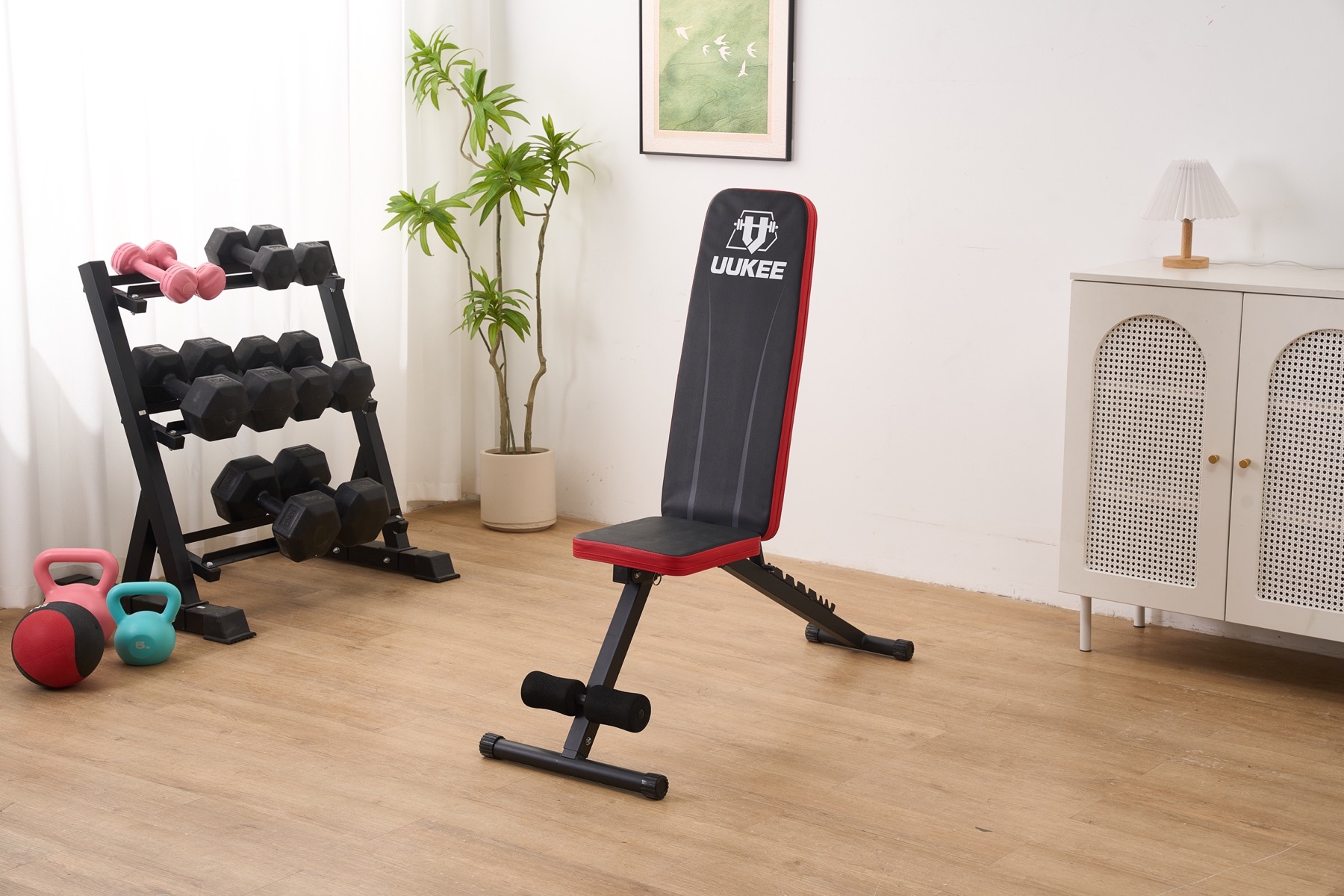 UUKEE weight bench in a bright home workout space